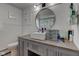 Stylish bathroom featuring a modern sink, vanity, and decorative mirror at 5014 Dawn St, Anderson, IN 46013