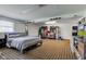 Spacious bedroom features a large bed, window with blinds, and closet with ample hanging space at 5014 Dawn St, Anderson, IN 46013