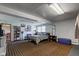 Bright bedroom with tan carpet, natural light from the window, and an open entrance at 5014 Dawn St, Anderson, IN 46013