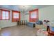 Versatile bonus room with modern chandelier, wood flooring, and neutral walls ready for personalization at 5014 Dawn St, Anderson, IN 46013