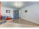 Bright bonus room with hardwood floors, modern lighting, and natural light at 5014 Dawn St, Anderson, IN 46013