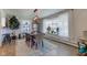 Sunlit dining room featuring a hardwood floor, designer lighting, and large windows at 5014 Dawn St, Anderson, IN 46013
