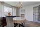 Well-lit dining room featuring neutral decor, light wood floors, and modern furniture at 5014 Dawn St, Anderson, IN 46013