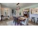Open dining area with modern lighting, wood floors, and easy access to the kitchen at 5014 Dawn St, Anderson, IN 46013