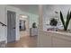 Elegant home entryway leading into bright living spaces with hardwood floors and neutral tones at 5014 Dawn St, Anderson, IN 46013