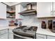 Close-up of kitchen details featuring new oven, custom cabinetry and modern countertops at 5014 Dawn St, Anderson, IN 46013