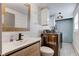 Laundry room with ample storage, sleek front load washer and dryer, and a modern vanity at 5014 Dawn St, Anderson, IN 46013