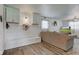 Cozy living room features built in bench seating and soft neutral color scheme at 5014 Dawn St, Anderson, IN 46013