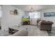 Bright and open living room features large picture window and plush neutral carpeting at 5014 Dawn St, Anderson, IN 46013