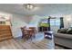 This multi-use living space features a living room area and dining area with stairs leading to the upper level at 5014 Dawn St, Anderson, IN 46013