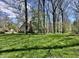 Expansive backyard with mature trees, perfect for outdoor activities and relaxation at 5205 Mosswood Ct, Indianapolis, IN 46254