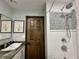 Modern bathroom with a unique vessel sink, tiled shower, and stylish fixtures at 5205 Mosswood Ct, Indianapolis, IN 46254