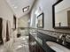 Elegant bathroom with double sinks, granite countertop, walk-in shower, and modern fixtures at 5205 Mosswood Ct, Indianapolis, IN 46254