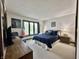 Cozy bedroom offering lots of natural light with serene outdoor views, complemented by soft carpet and lamps at 5205 Mosswood Ct, Indianapolis, IN 46254
