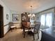 Traditional dining room featuring a wood table set, hutch, and decorative lighting at 5205 Mosswood Ct, Indianapolis, IN 46254