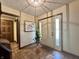 Inviting entryway featuring tile flooring, white front door, and decorative plant at 5205 Mosswood Ct, Indianapolis, IN 46254