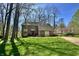 Beautiful brick home with a well-manicured lawn and landscaping, featuring mature trees at 5205 Mosswood Ct, Indianapolis, IN 46254