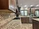 Well-appointed kitchen with stainless steel appliances, granite countertops, and tiled backsplash at 5205 Mosswood Ct, Indianapolis, IN 46254