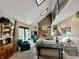 Comfortable living room with a brick fireplace, vaulted ceilings, and a second story balcony at 5205 Mosswood Ct, Indianapolis, IN 46254