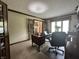 Spacious office featuring a functional desk, natural light, and French doors for work or relaxation at 5205 Mosswood Ct, Indianapolis, IN 46254