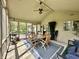 Relaxing screened porch with comfortable seating and an outdoor dining area at 5205 Mosswood Ct, Indianapolis, IN 46254