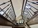 Looking up a staircase with iron railing toward a skylight at 5205 Mosswood Ct, Indianapolis, IN 46254