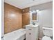 Cozy bathroom featuring tile flooring and a classic white sink vanity, along with tiled shower and tub at 5209 Melrose Ave, Indianapolis, IN 46241