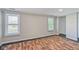 Bedroom with decorative flooring, two windows with blinds and a large closet space at 5209 Melrose Ave, Indianapolis, IN 46241