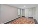 Bedroom with decorative flooring, a window with blinds and a large closet space at 5209 Melrose Ave, Indianapolis, IN 46241