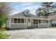 Quaint single-story home with a welcoming front porch and ample parking space at 5209 Melrose Ave, Indianapolis, IN 46241
