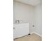 Functional laundry room with essential hook-ups and tile flooring at 5209 Melrose Ave, Indianapolis, IN 46241