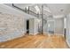 Spacious living area featuring skylights, a loft with railing, and a spiral staircase at 5209 Melrose Ave, Indianapolis, IN 46241