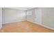 Neutral room featuring tile flooring, a window and white door with convenient electrical outlets at 5209 Melrose Ave, Indianapolis, IN 46241
