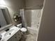 Bathroom with a shower and tub, offering a fresh vanity and modern fixtures and stylish décor at 5529 W Turnbuckle Pl, McCordsville, IN 46055