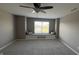 Spacious bedroom has a ceiling fan and cozy window seat with storage beneath at 5529 W Turnbuckle Pl, McCordsville, IN 46055
