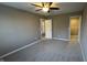Neutral bedroom with ceiling fan, closet and doorways at 5529 W Turnbuckle Pl, McCordsville, IN 46055