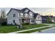 Beautiful two-story home with gray siding, black shutters, and a well-maintained lawn showcasing suburban living at 5529 W Turnbuckle Pl, McCordsville, IN 46055