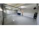 Clean garage with epoxy flooring, shelving, and organization system at 5529 W Turnbuckle Pl, McCordsville, IN 46055