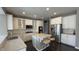 Beautiful kitchen featuring granite countertops, stainless steel appliances, and a kitchen island with breakfast bar at 5529 W Turnbuckle Pl, McCordsville, IN 46055