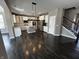 Gourmet kitchen features stainless steel appliances, quartz countertops, island, and an open floor plan at 5529 W Turnbuckle Pl, McCordsville, IN 46055