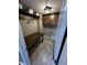 Convenient laundry room features cabinets and a folding table to simplify tasks at 5529 W Turnbuckle Pl, McCordsville, IN 46055