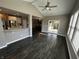 Open-concept living room with easy access to the outdoor patio through sliding glass doors at 5529 W Turnbuckle Pl, McCordsville, IN 46055