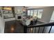 Open-concept living room with custom wall decorations, fireplace, and grey sectional sofa at 5529 W Turnbuckle Pl, McCordsville, IN 46055