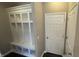 Mudroom with custom built-in storage and a bench, offering a practical and organized entryway at 5529 W Turnbuckle Pl, McCordsville, IN 46055