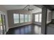 Bright sunroom with large windows, offering ample natural light and a view of the backyard at 5529 W Turnbuckle Pl, McCordsville, IN 46055