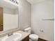 Bathroom featuring a toilet and large countertop with mirror at 5666 Ensley Ct, Indianapolis, IN 46254