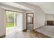 Relaxing dining area featuring wood floors and door to the backyard at 5666 Ensley Ct, Indianapolis, IN 46254