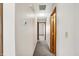 Hallway features carpet, neutral walls, and wood trim on the doors at 5666 Ensley Ct, Indianapolis, IN 46254