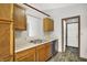 Kitchen featuring stainless steel appliances, double sinks, and new plank flooring at 5666 Ensley Ct, Indianapolis, IN 46254