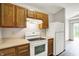 The kitchen featuring essential appliances, and a view of the back yard at 5666 Ensley Ct, Indianapolis, IN 46254